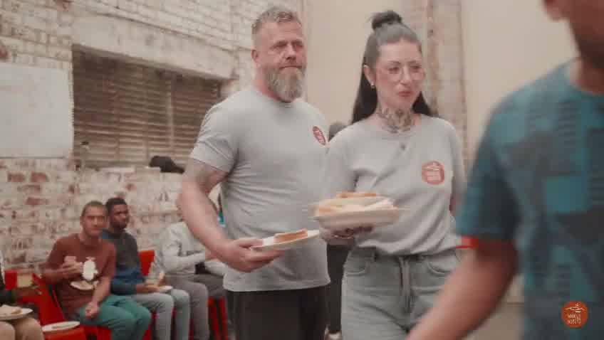 Good Hope volunteers serving food to guests at an outdoor outreach in Cape Town