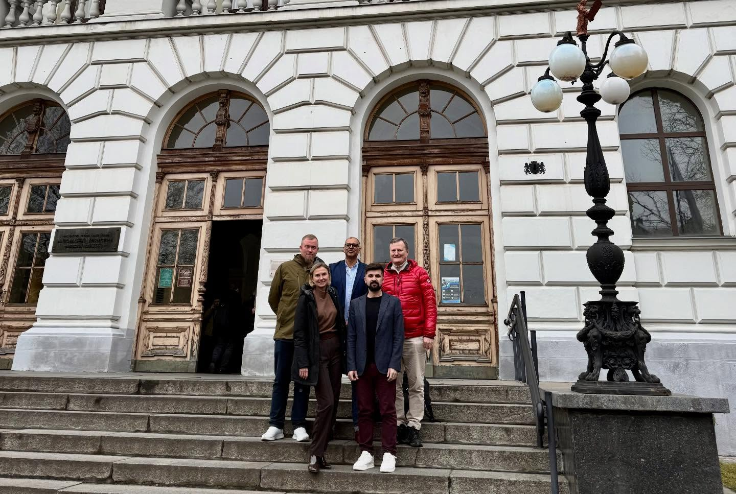 Delegation on the steps of a historic university building in Kyiv
